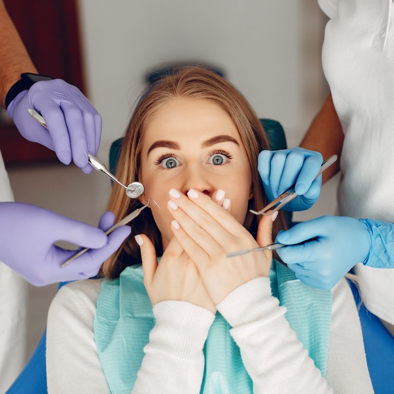 Beautiful lady in the dentist's office. Woman in a uniform