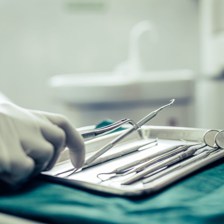 Dentists choose equipment on the table.